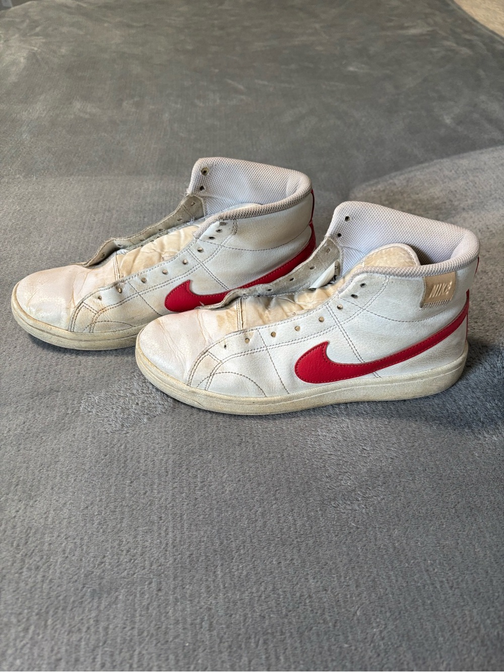 Nike White High-Top Sneakers with Red Swoosh